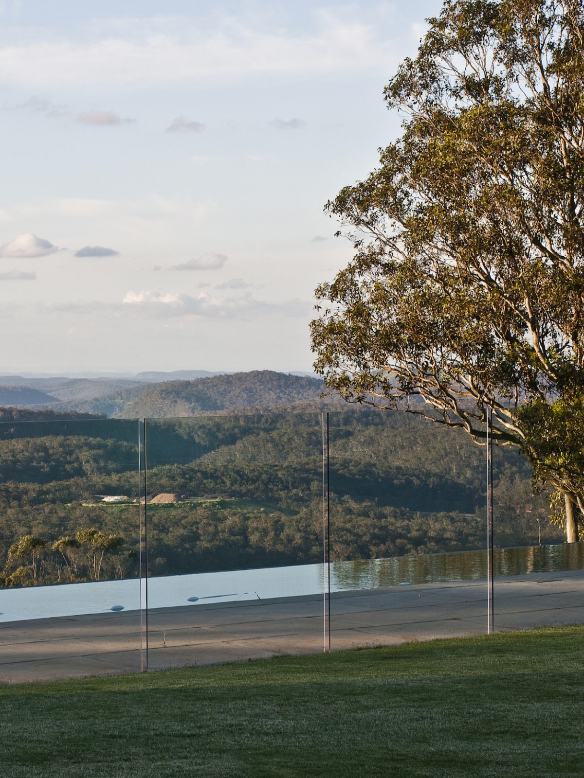 Earth mound Garden NBL Glass fenced terrace and pool with a view over the escarpment at Mittagong