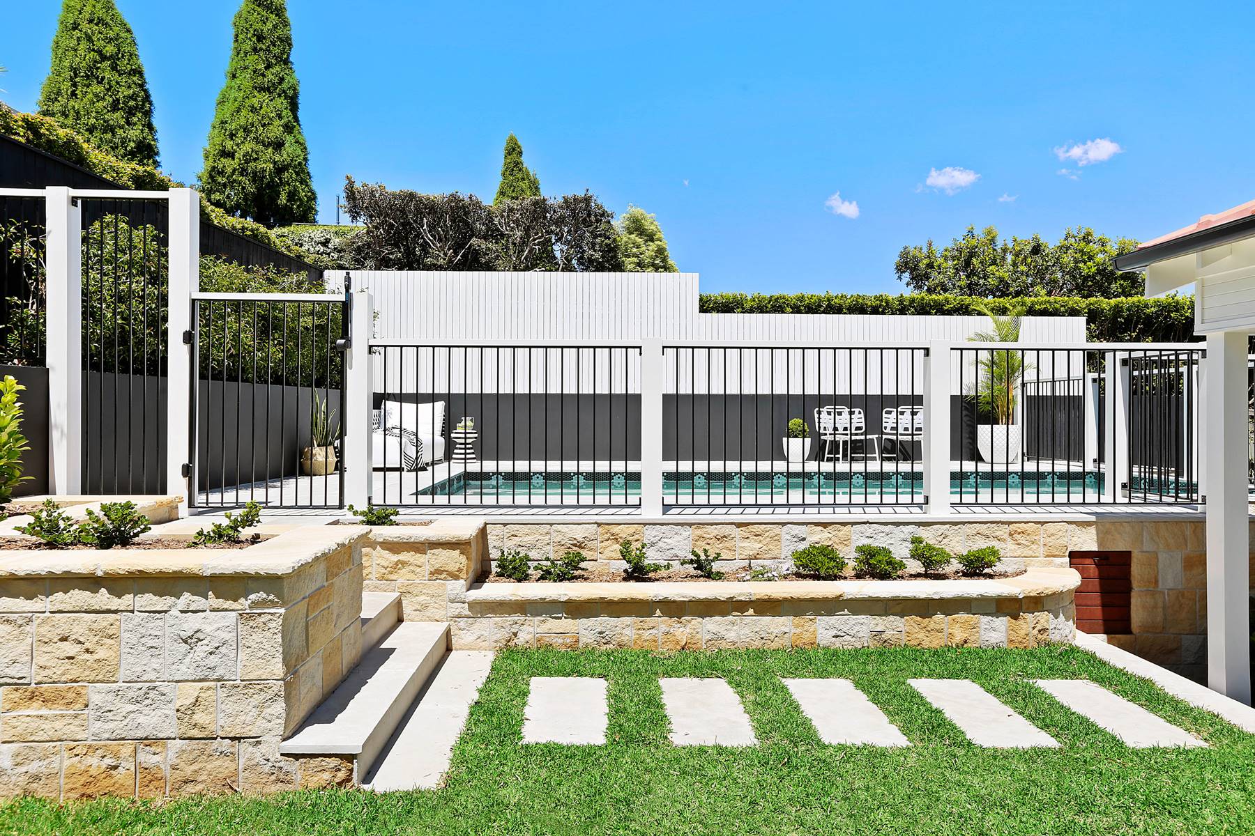 Timber and steel pool fence with planting held outside the non-climbable zone, Mosman